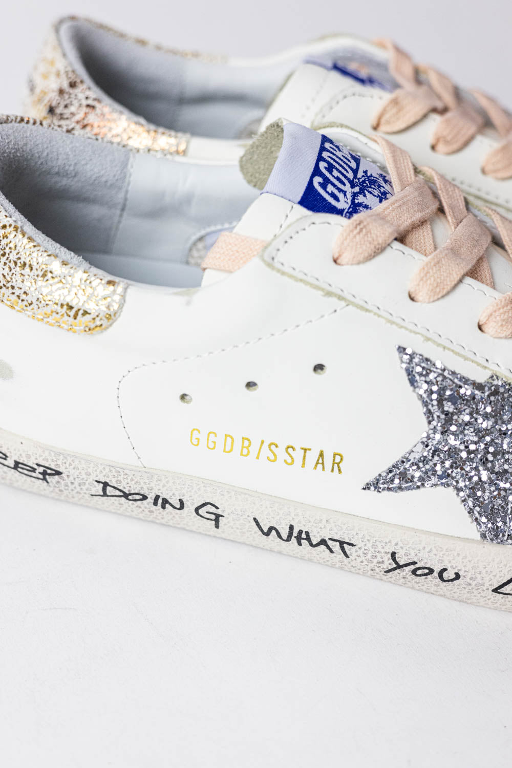 Golden Goose Super-Star with silver glitter star and leopard print heel tab
