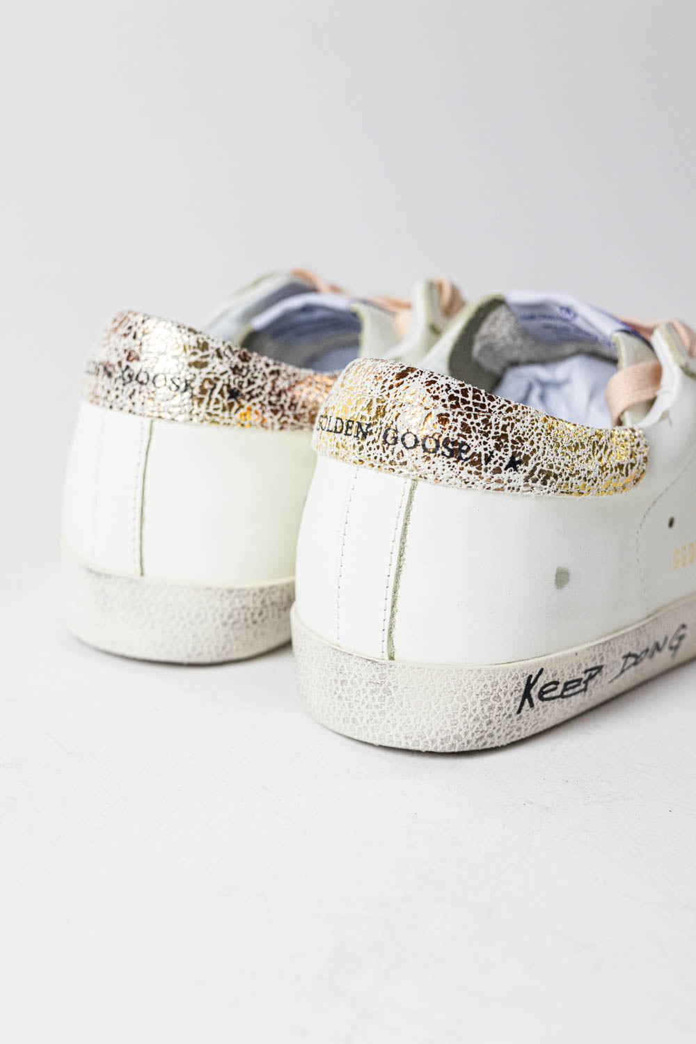Golden Goose Super-Star with silver glitter star and leopard print heel tab