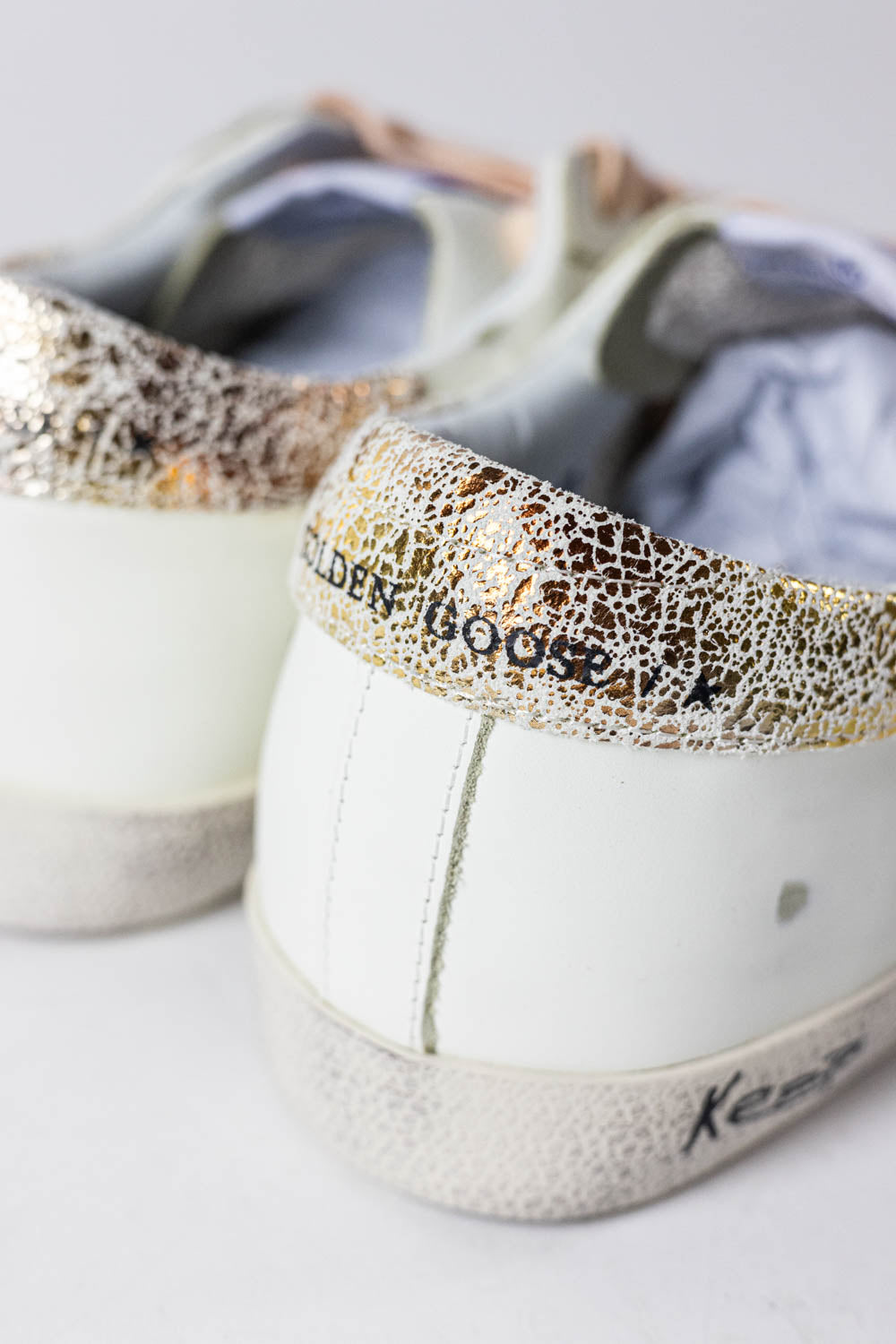 Golden Goose Super-Star with silver glitter star and leopard print heel tab