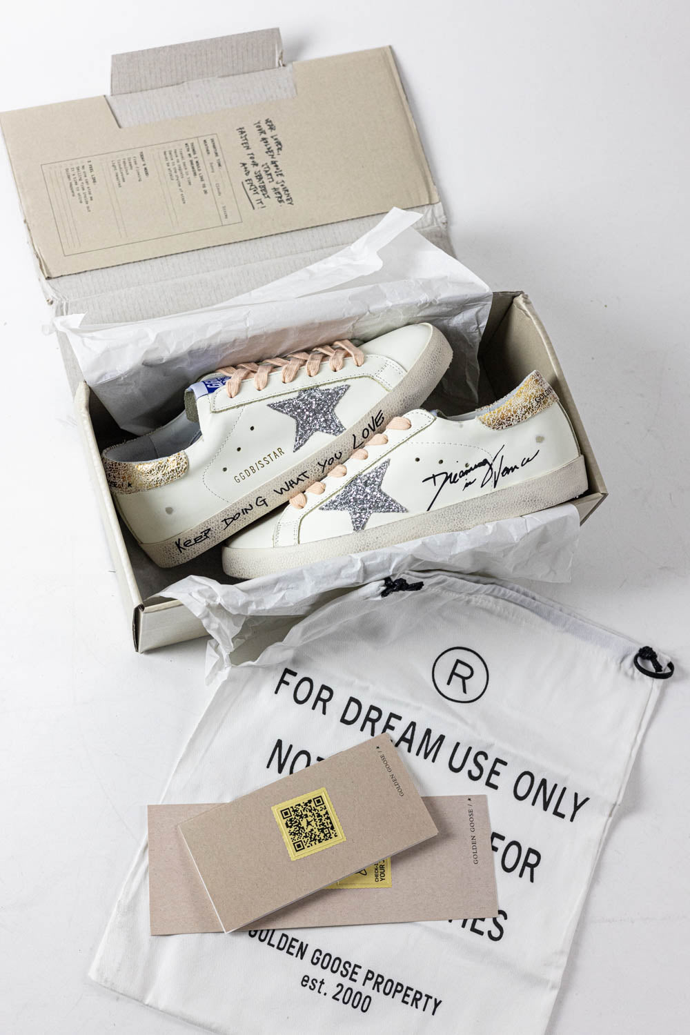 Golden Goose Super-Star with silver glitter star and leopard print heel tab
