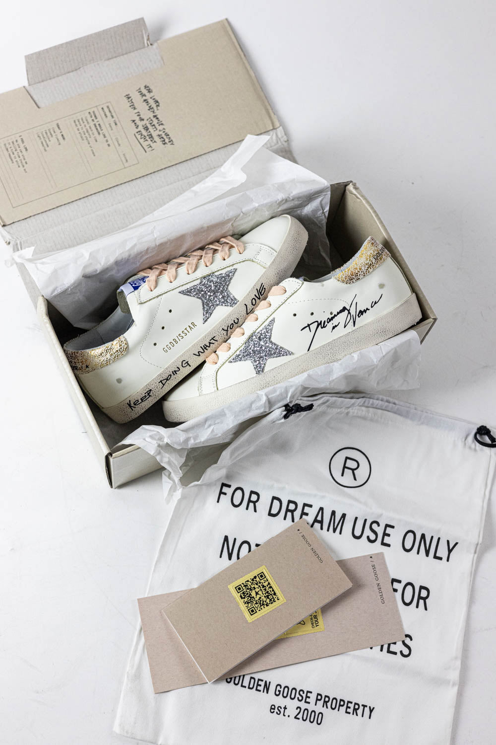 Golden Goose Super-Star with silver glitter star and leopard print heel tab