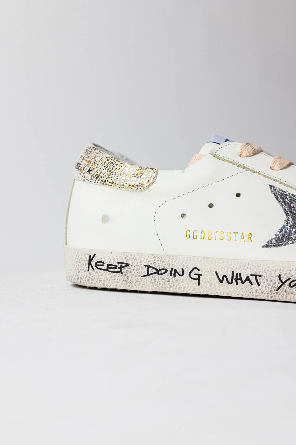 Golden Goose Super-Star with silver glitter star and leopard print heel tab