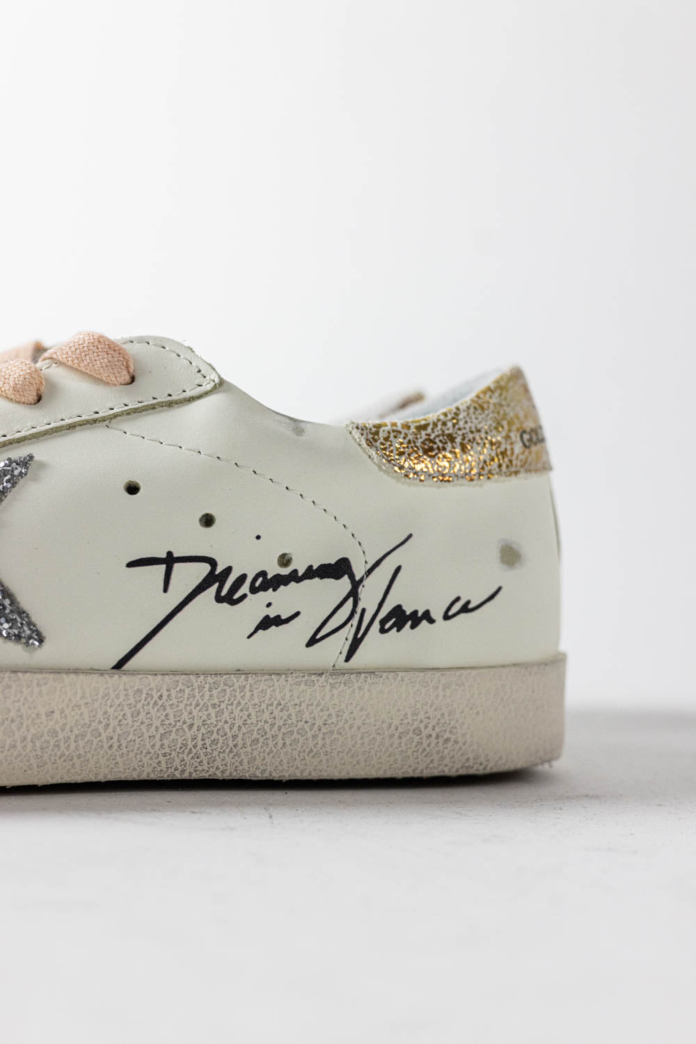 Golden Goose Super-Star with silver glitter star and leopard print heel tab