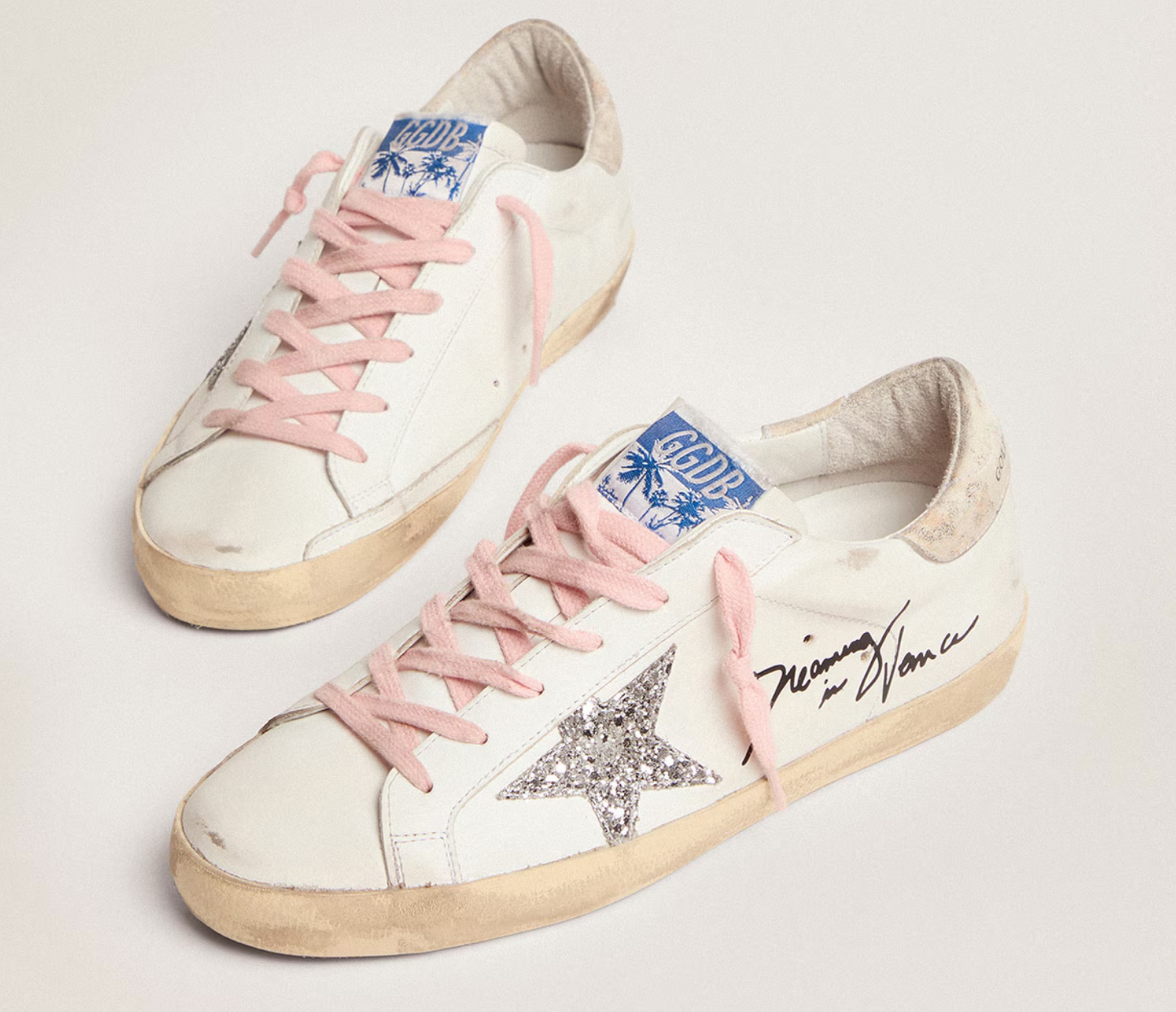 Golden Goose Super-Star with silver glitter star and leopard print heel tab